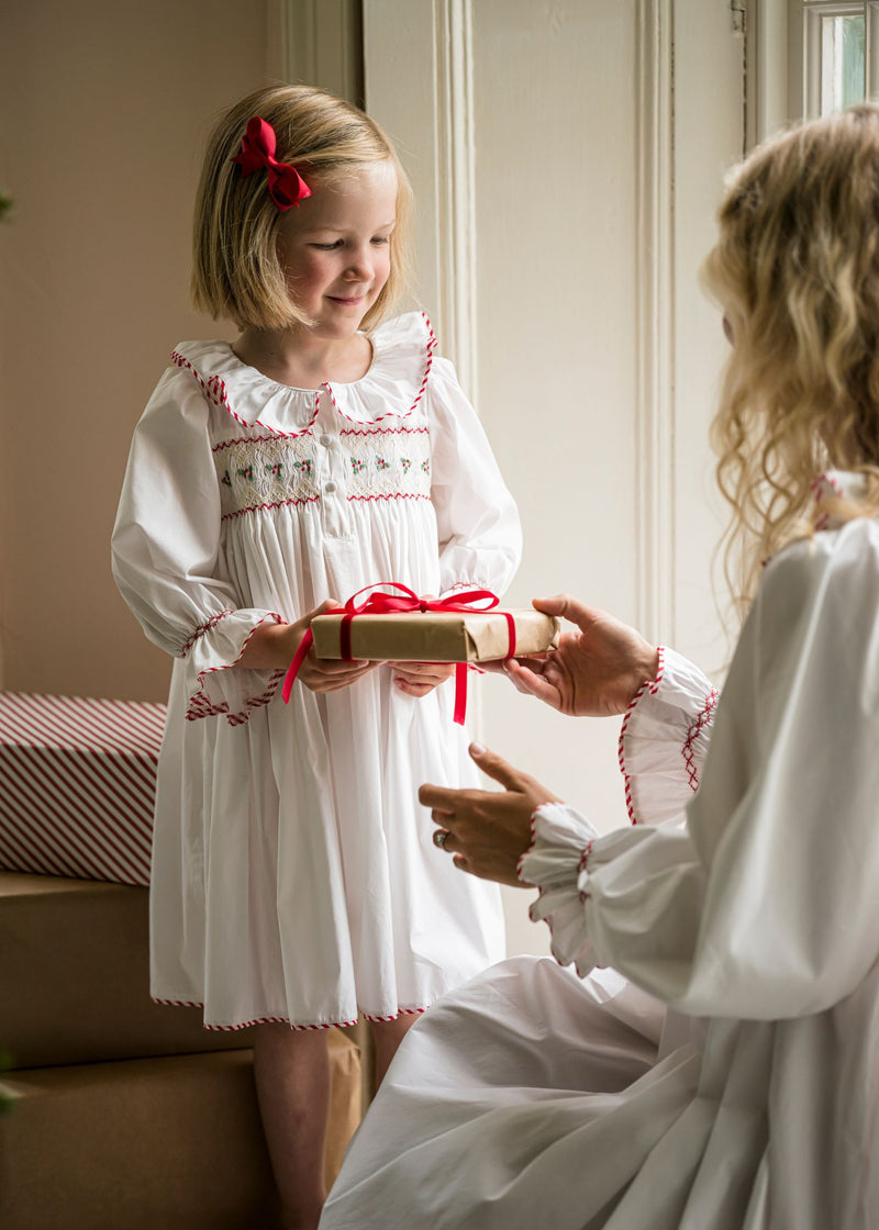 Samantha Varvel x Smock London Nightingale Girls Dress Moonstone White with Candy Cane Trim and Holly Hand Smocking