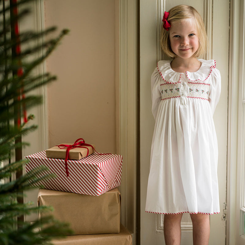 Samantha Varvel x Smock London Nightingale Girls Dress Moonstone White with Candy Cane Trim and Holly Hand Smocking