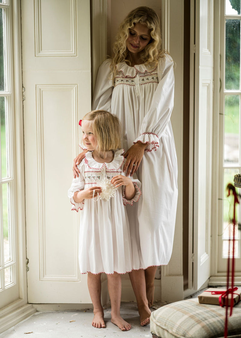 Samantha Varvel x Smock London Nightingale Girls Dress Moonstone White with Candy Cane Trim and Holly Hand Smocking