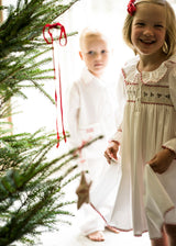 Samantha Varvel x Smock London Nightingale Girls Dress Moonstone White with Candy Cane Trim and Holly Hand Smocking